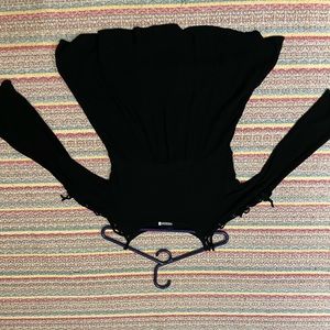 Flowy black top with lace up sleeves